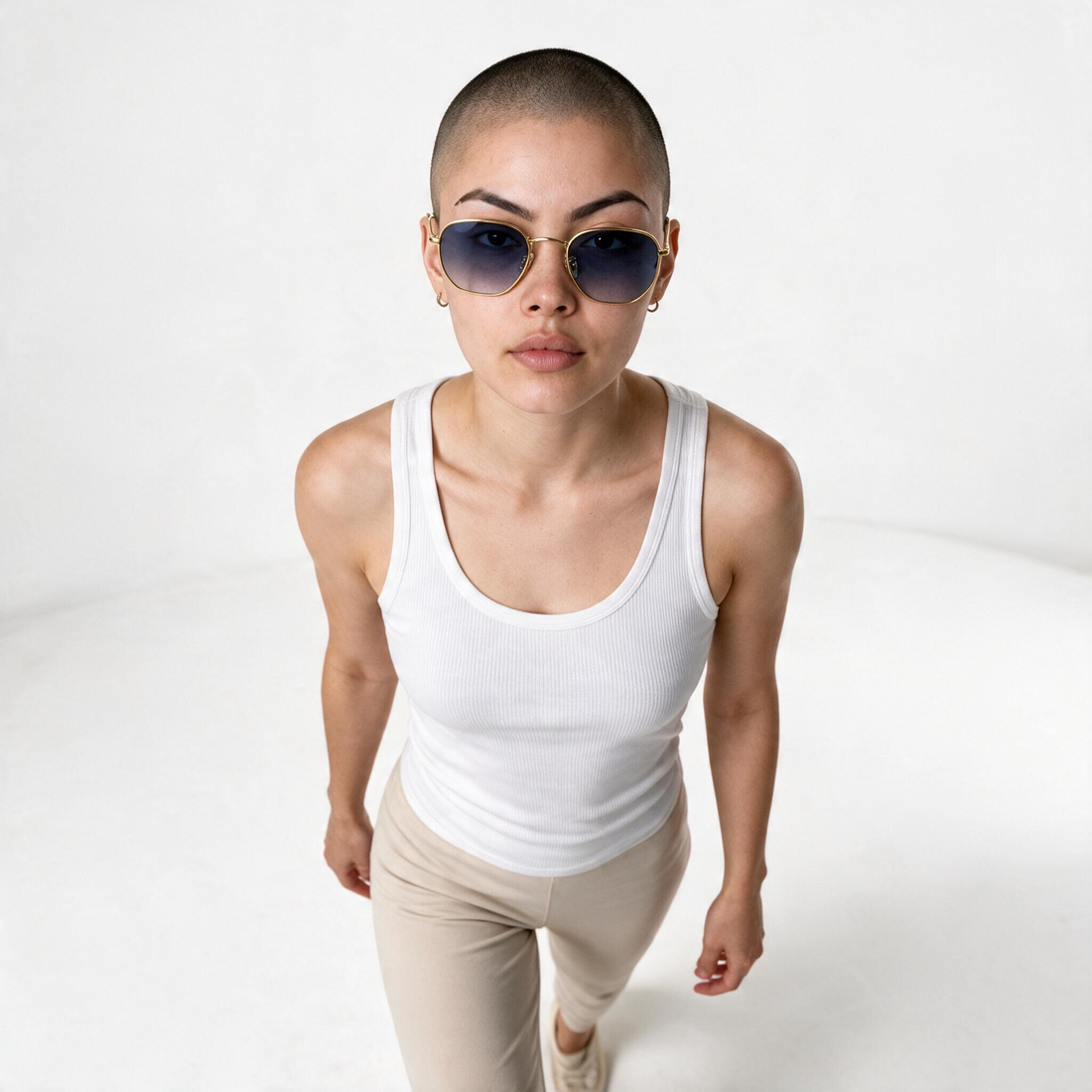 Model wearing lavunett Hexa Gold sunglasses