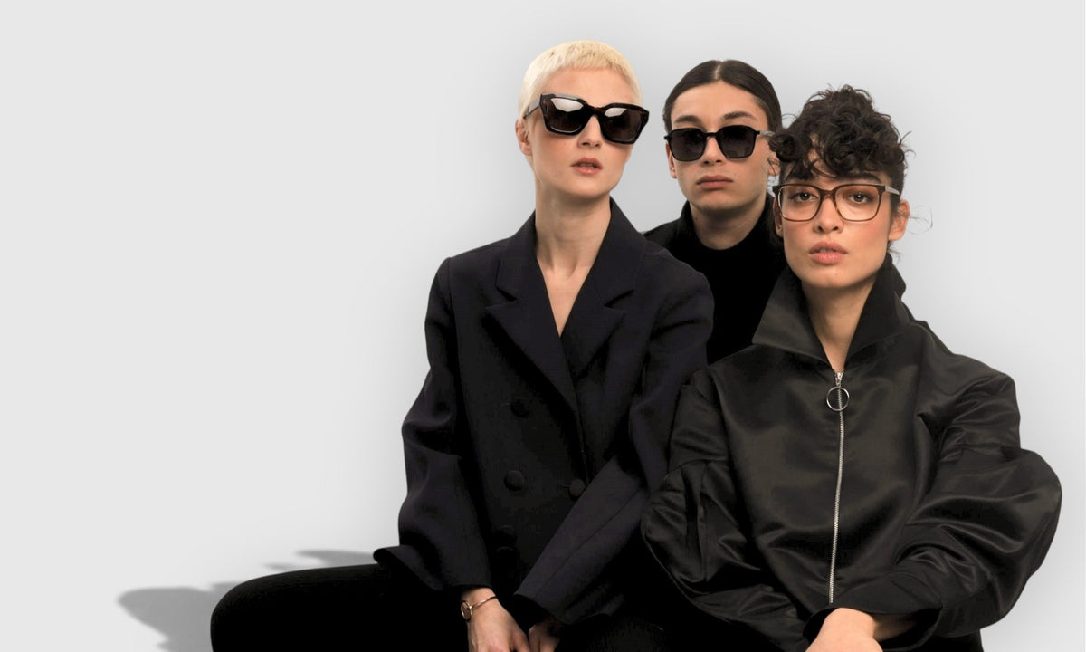 Three models wearing Lavunett sunglasses and eyeglasses on a soft grey background